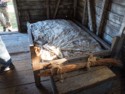 Old bed with mattress stuffed with corn cobs or cotton